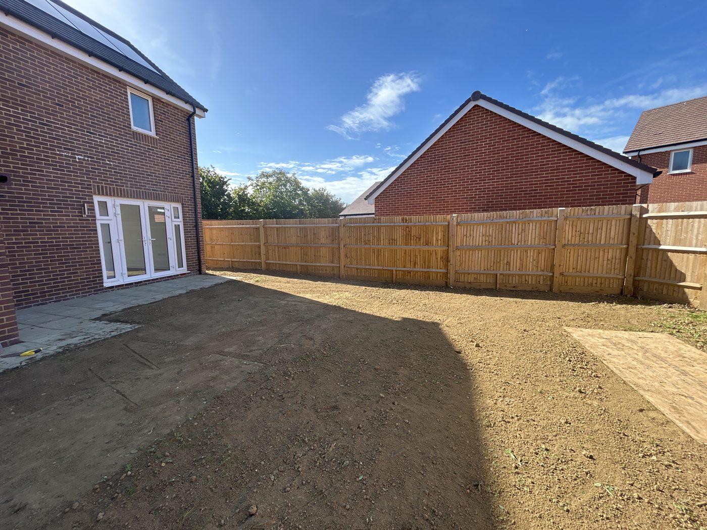 Prep: the rear garden ground cultivated and levelled before turfing.